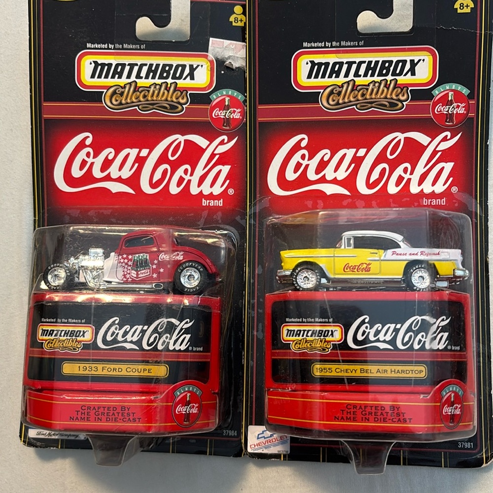 Two new in box Coca Cola cars